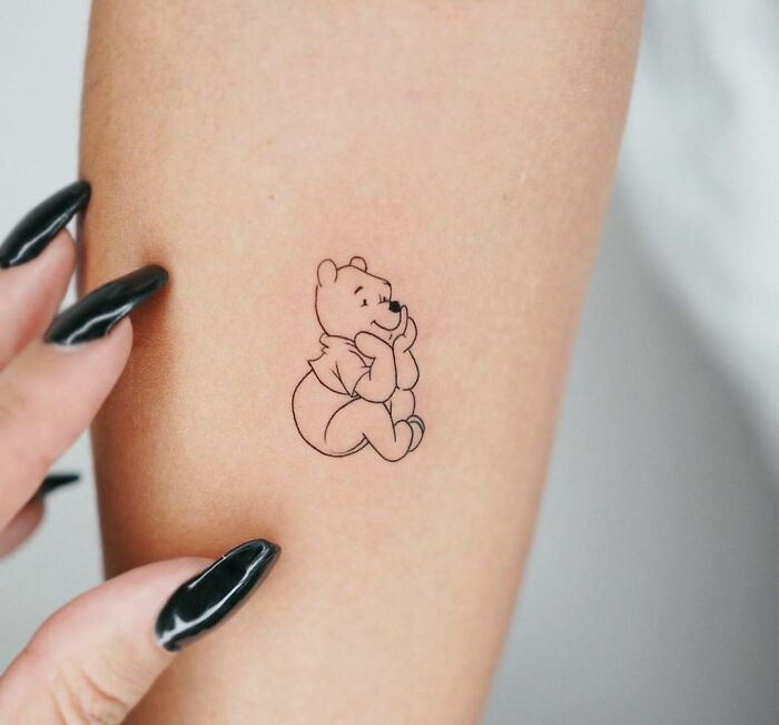 minimalistic tattoo of winnie the pooh