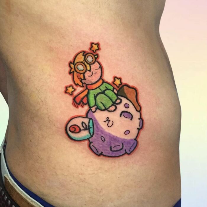 Colorful The Little Prince ribs tattoo