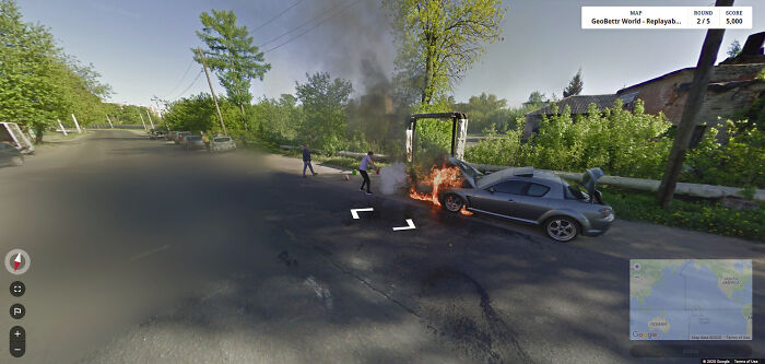 A Russian Man Trying To Put Out A Fire In His Mazda Rx8