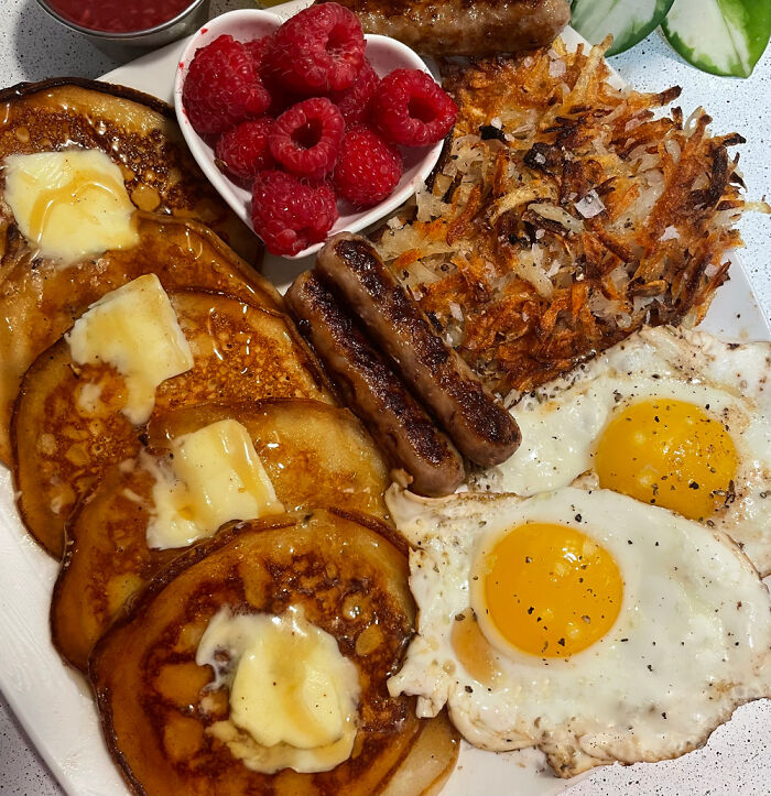 Buttermilk Pancakes, Sausage, Hash Browns, Eggs, And Raspberries