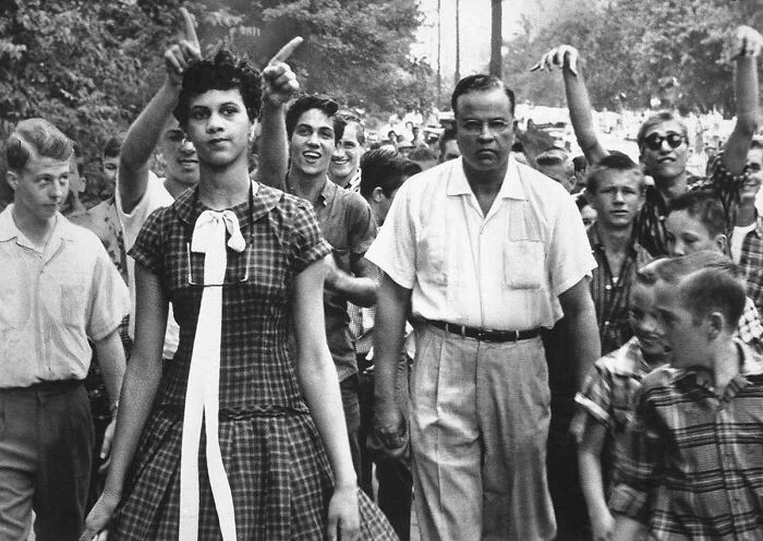 Dorothy Counts, 15, Is Taunted And Harassed By White Students As She Makes Her Way From Harding High School As The Only Black Student At The Newly Desegregated School. Charlotte, North Carolina. 1957