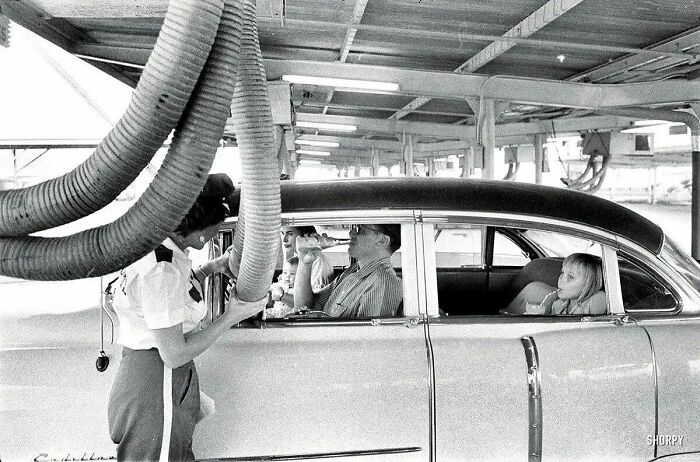 A Family At A Drive-In Restaurant Has Cool Air Piped Into Their Car. 1957