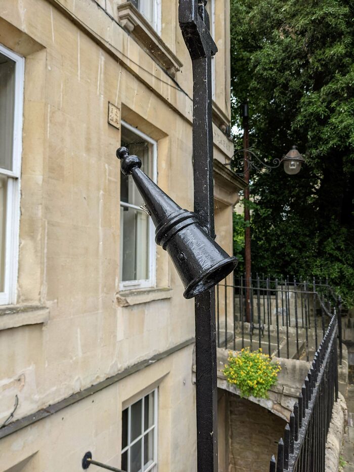 Iron Cone On Either Side Of A Gate Outside The Entry To A Building In Bath England