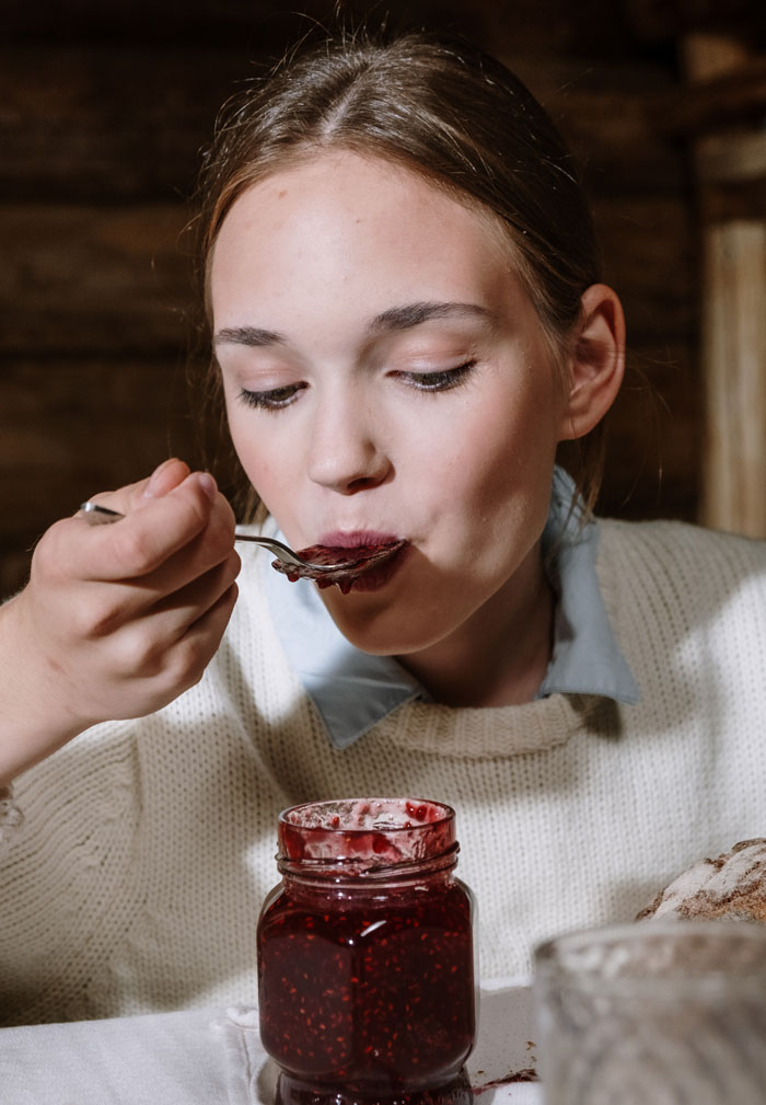 Woman tasting a jam 