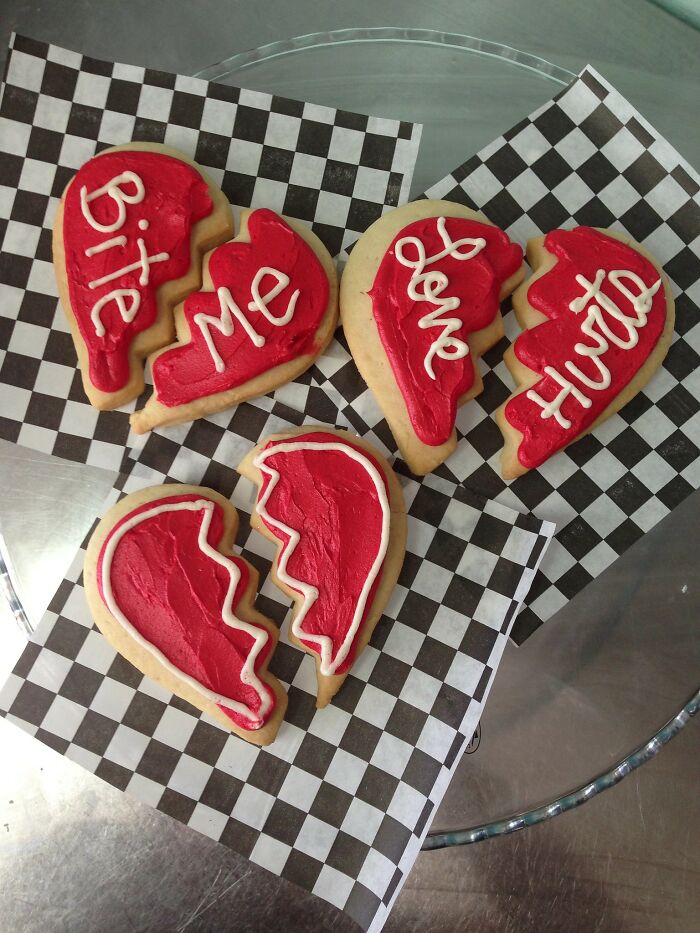 Heart-shaped cookies with icing phrases, symbolizing relationship insights.