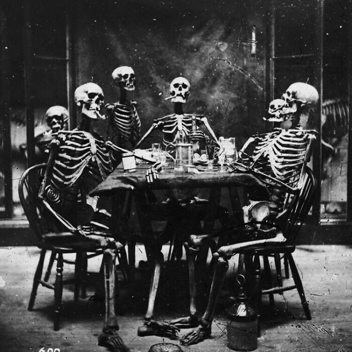 Six Skeletons Smoking Around A Dinner Table, Circa 1865