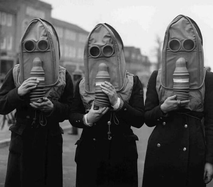 Three Air Raid Wardens Wearing A New Type Of Gas Mask That Are Designed For The Elderly. Photo Taken In 1941