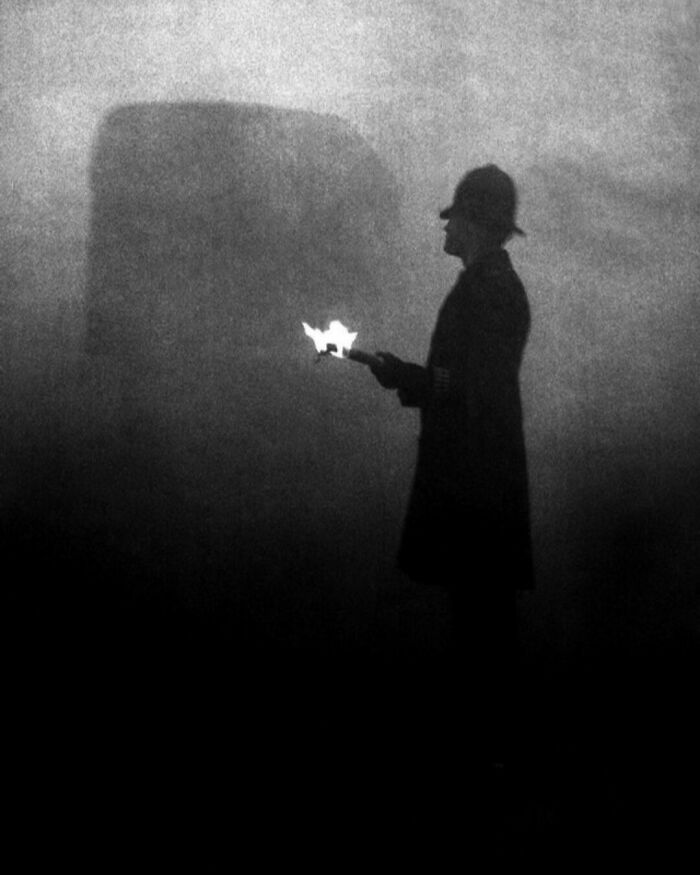 A Policeman In Daytime Directing Traffic During The "Great Smog Of London". This Photo Was Taken In 1952