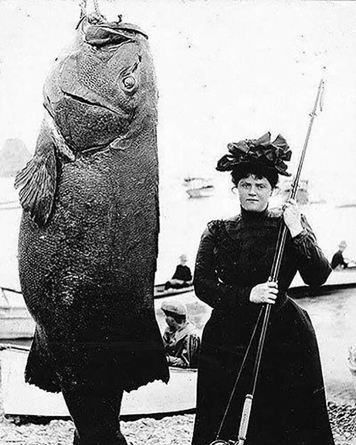 A Well-Dress Mrs E. N. Dickerson Of NYC (Right) Poses Next To The 363 Pound Black Sea Bass She Caught Off The Coast Of New York In 1901