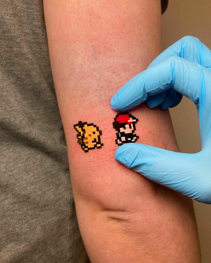 minimalistic tattoo of pixelated pikachu and mario
