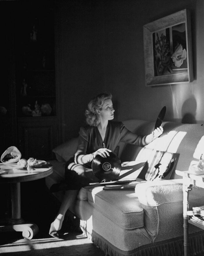 Greer Garson Sorting Through Her Record Collection In The Living Room Of Her Los Angeles Home, A Month After Her Best Actress Oscar Victory For Mrs. Miniver (1942), 1943