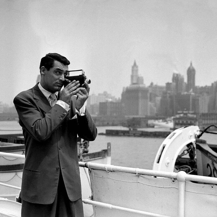 Cary Grant Taking Pot Shots With His Camera Of The New York Skyline, As He Comes Up The Bay On The S.s. Ile De France, 1938