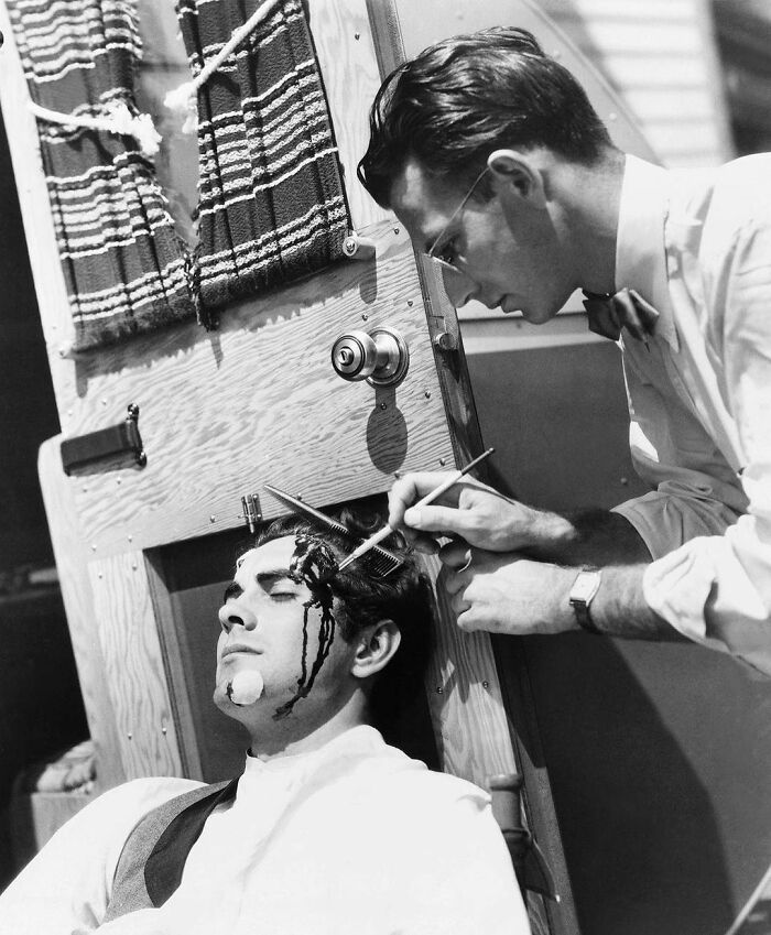 Makeup Artist Ben Nye Applying False Blood On Actor Tyrone Power Between Takes In Filming In Old Chicago, 1938