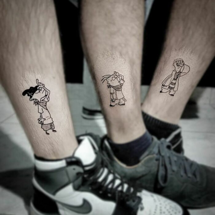 Three best friend tattoos on legs featuring cartoon characters, symbolizing friendship.