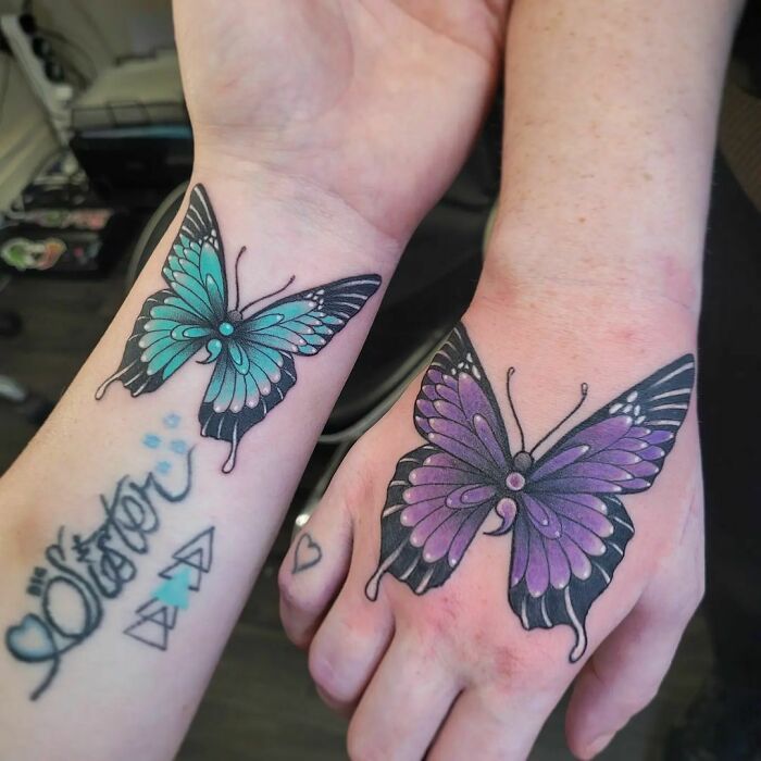 Two matching blue and purple butterfly tattoos