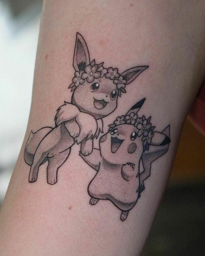 Pokémon characters Eevee and Pikachu tattoo