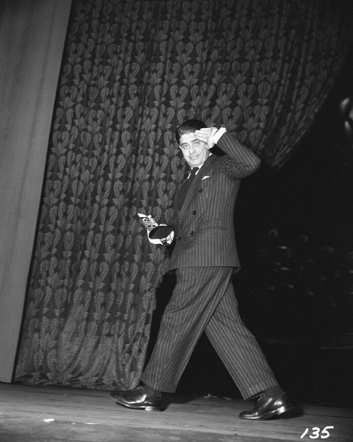 Alfred Newman Walking Off Stage After Winning Best Original Score For The Song Of Bernadette (1943) At The 16th Academy Awards, 1944