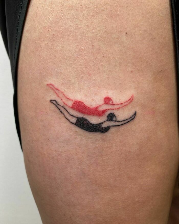 minimalistic tattoo of two swimmers