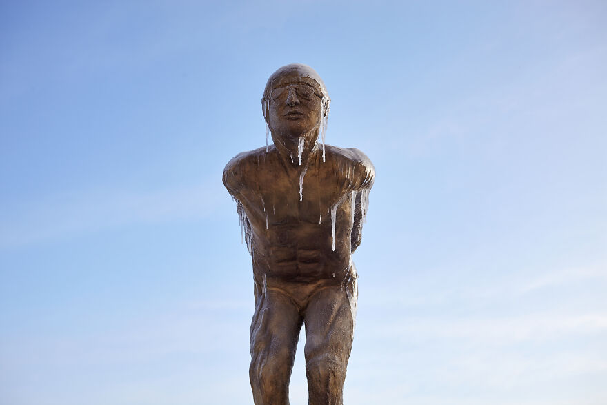 Sculptures Of Athletes Covered With Ice After An Icy Rain