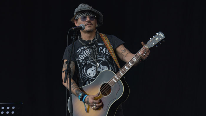 Johnny Depp playing with guitar