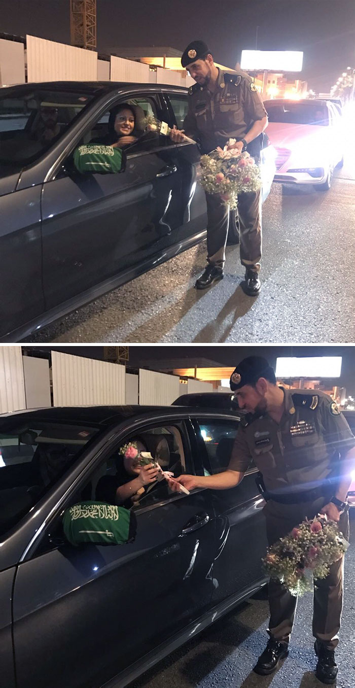 Saudi Police Officers Handing Out Roses To Women Drivers (Today Is The First Day They Can Drive Legally)
