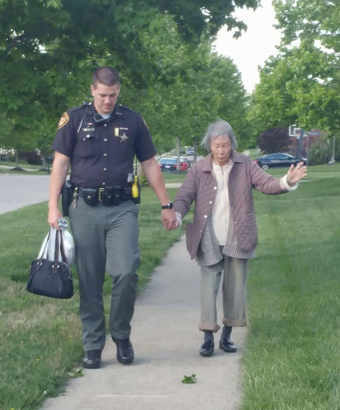 Ohio Sheriff's Deputy Taking The Time To Walk With An Elderly Woman, To Help Her Get Where She Was Going