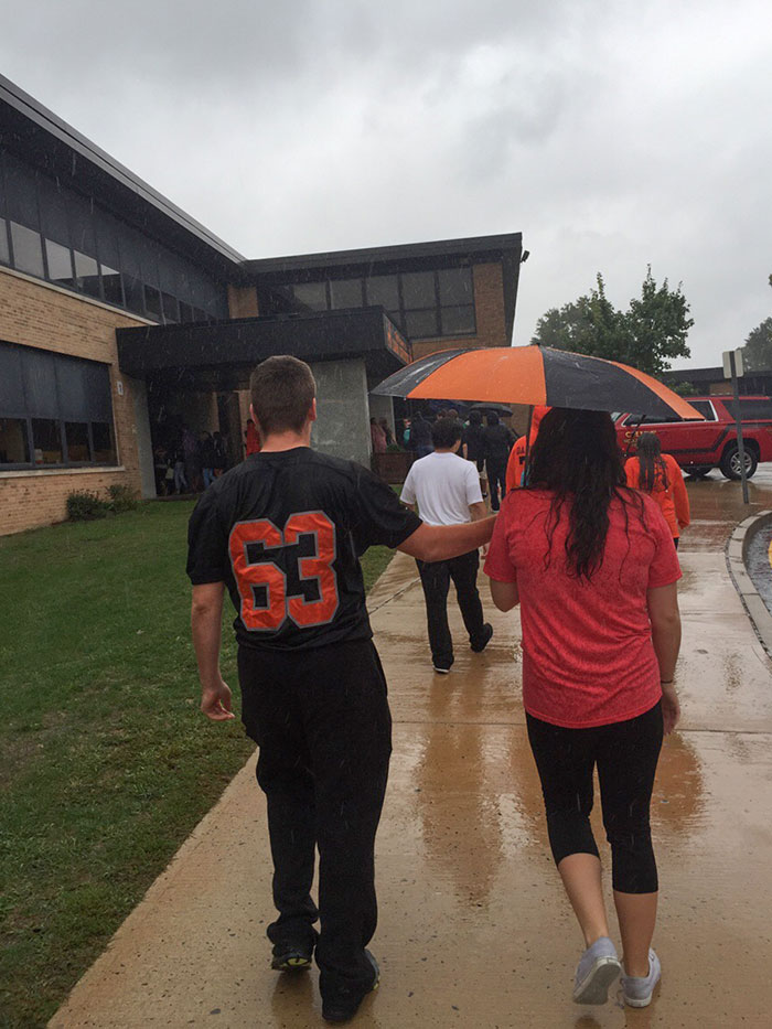 Evacuation Drill In The Rain. Chivalry Is Alive And Well