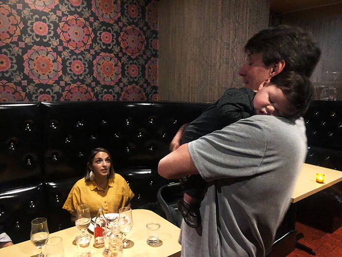 We Couldn’t Get Our Baby To Stop Crying At The Restaurant. So The Couple Next To Us Offered To Hold Him. Our Baby Slept On This Kind Strangers Shoulder The Entire Evening