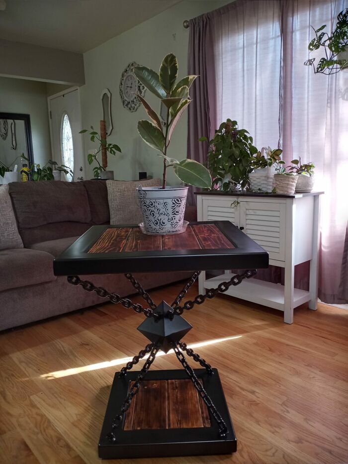 My Husband Is A Welding Fabricator. He Built Me This Table Out Of Scrap Metal, Chain, And Wood