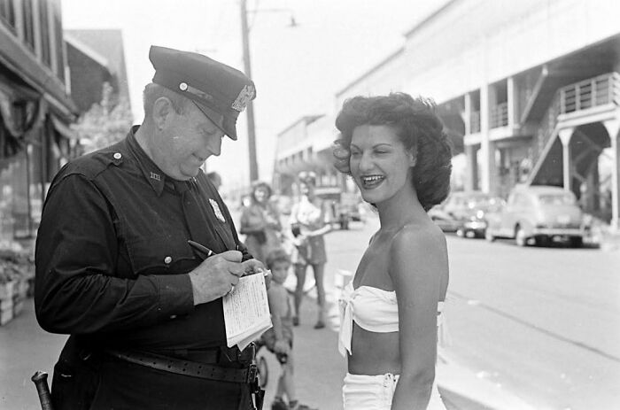 Woman Being Ticketed For ‘Indecent Exposure’ At Rockaway Beach Of New York, 1946