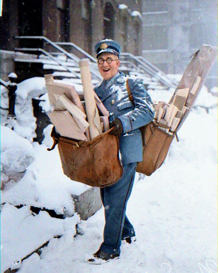 Mailman Poses With His Heavy Load Of Christmas Mail And Parcels. Chicago, USA. 1929. Colorized