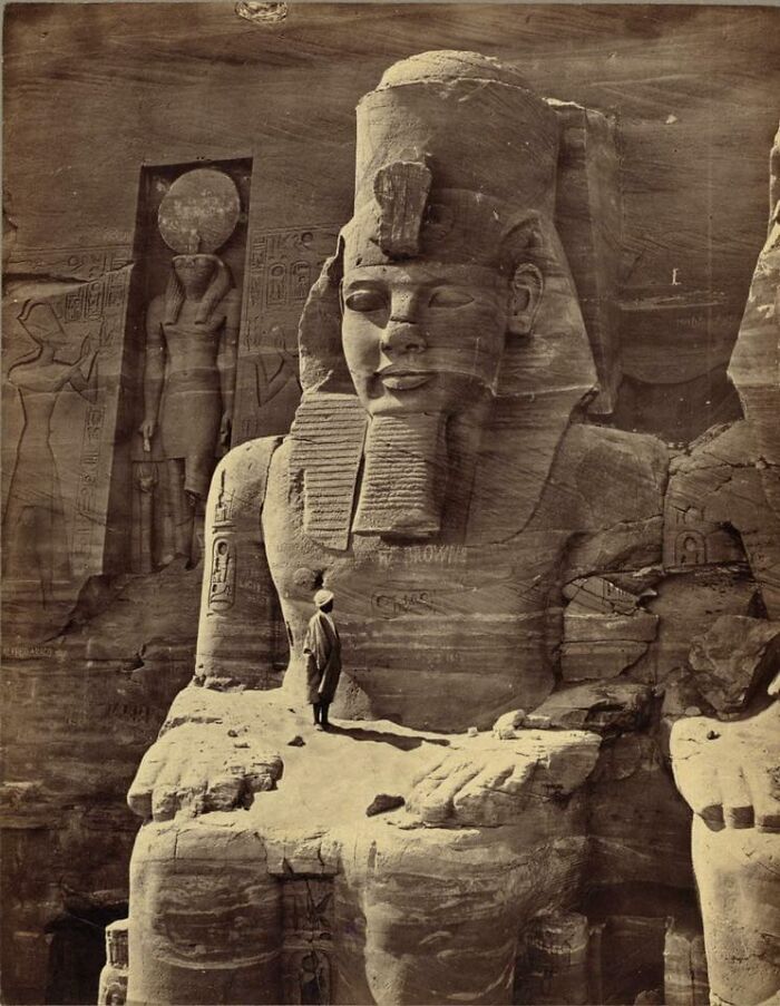 Man Standing On Lap Of Colossal Figure Of Ramses, 1856