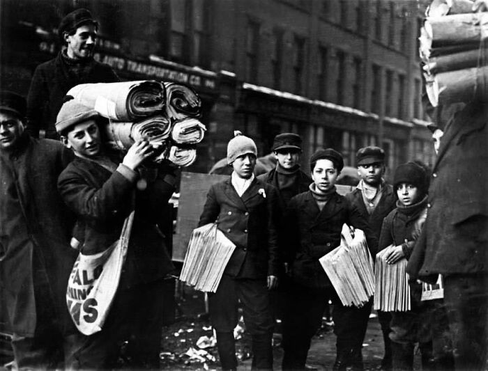 Newsies And Other Child Laborers Gather Outside A Newspaper Office. February, 1910