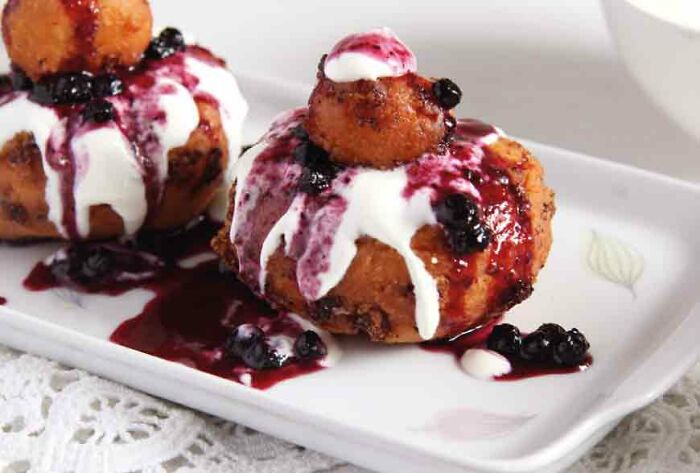 Papanași! A Delicious Doughy Dumpling/Doughnit Made With Soft Cheese, Served With Jam And Cream, From Romania And Moldova