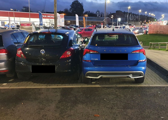 Guy Spots Two Cars Taking Up Multiple Spaces So Nobody Parks Next To Them, Finds A Satisfying Way To Get His Point Across