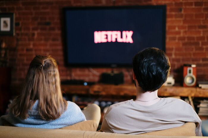 Couple Watching Netflix On TV 