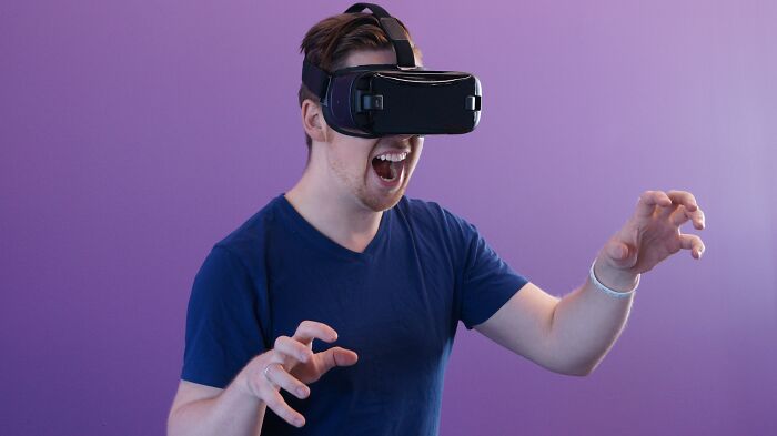 Man Playing Games Using A VR Headset 