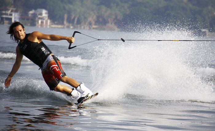 Man Wakeboarding While Being Pulled By A Boat 