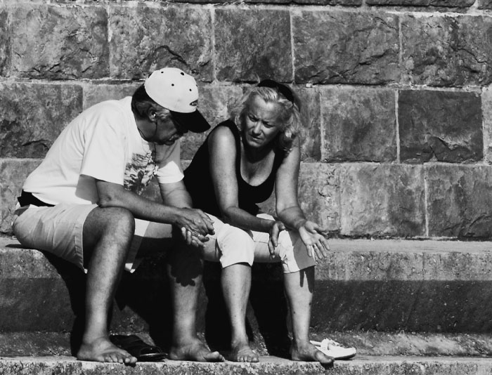 Two person sitting and talking