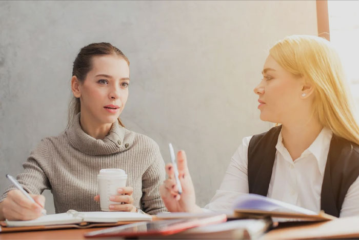 Two womans sitting and thinking