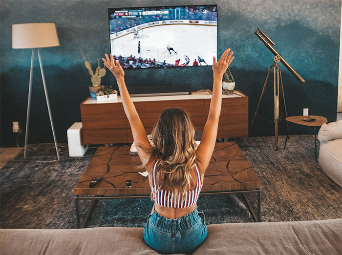 Woman watching sport game