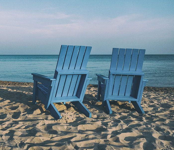 Blue chairs at the beach