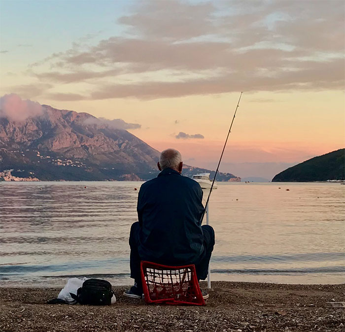 Person sitting and fishing