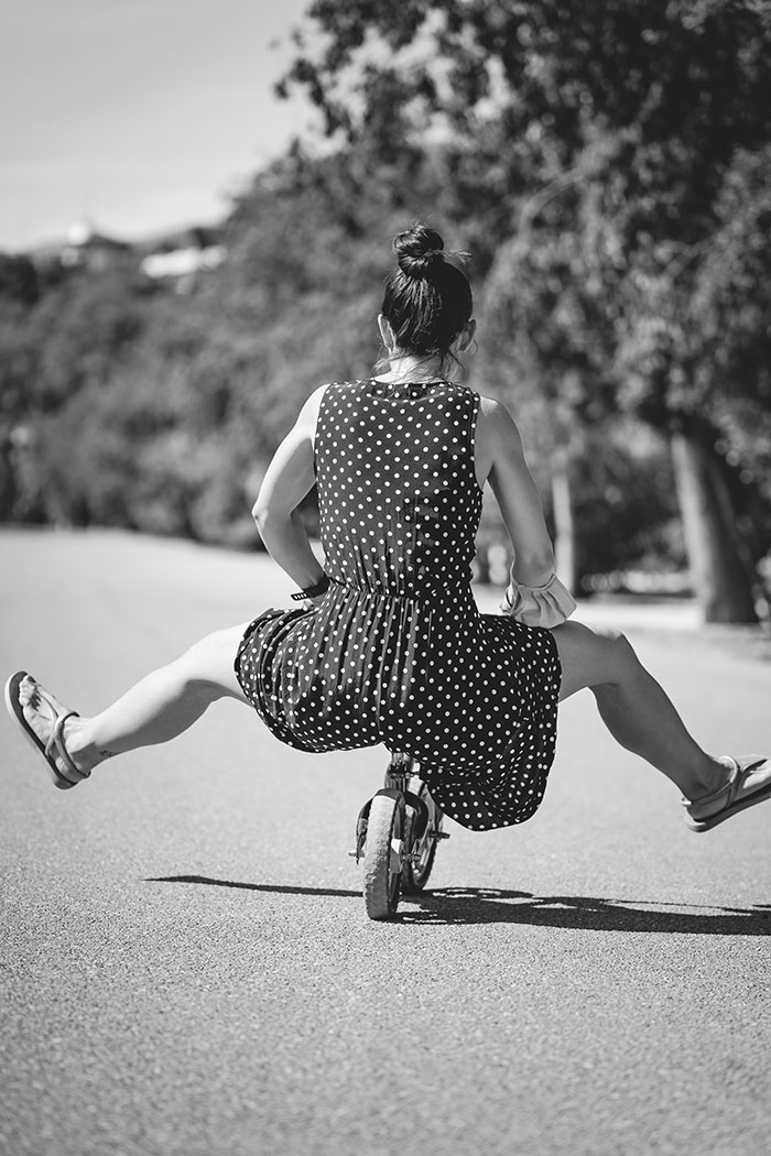 Woman rides mini bike
