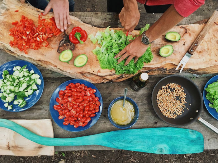 People preparing fresh and colorful food 
