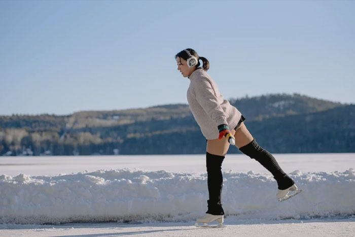 Woman Ice Skate On A Lake