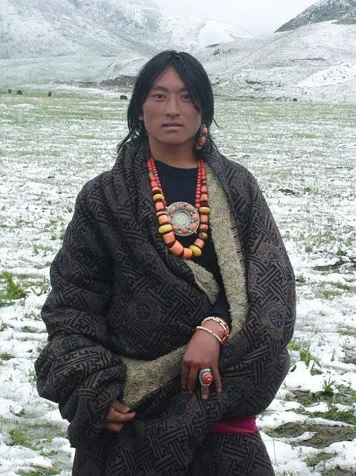 Tibetan Man Wearing Tibetan Jewelry And Ethnic Clothes