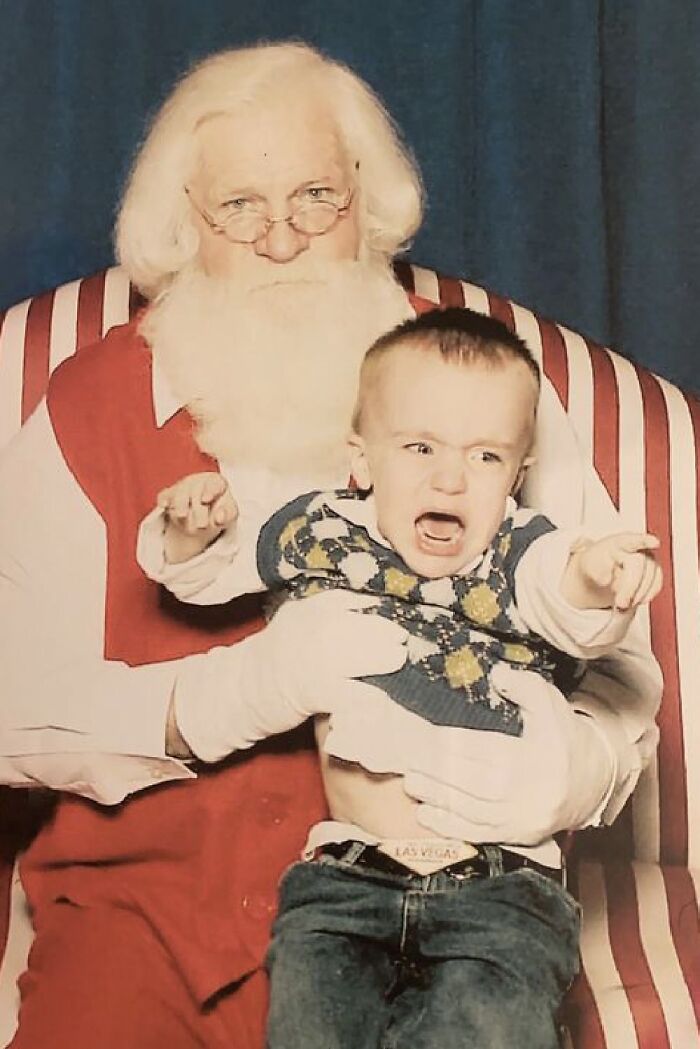 My Son Was Super Attached To Me For The First Few Years Of His Life. You Can See The Rage In Both His Face And Pointer Finger As I Stepped Away And Left Him With Jolly ‘Ol St. Nick
