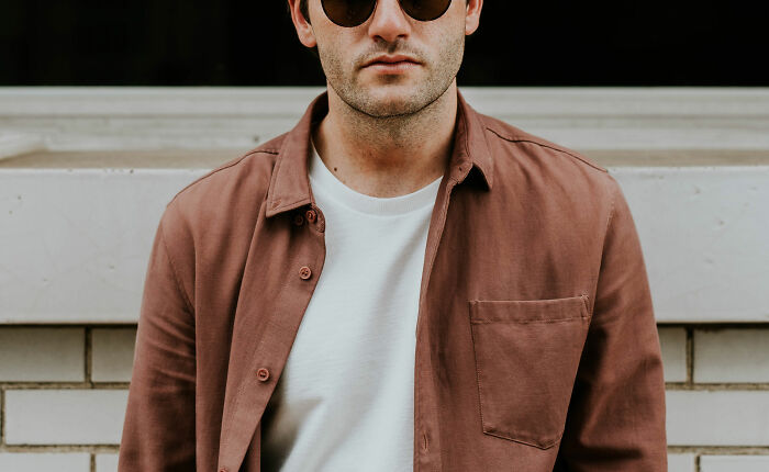 man wearing white t-shirt and sunglasses 