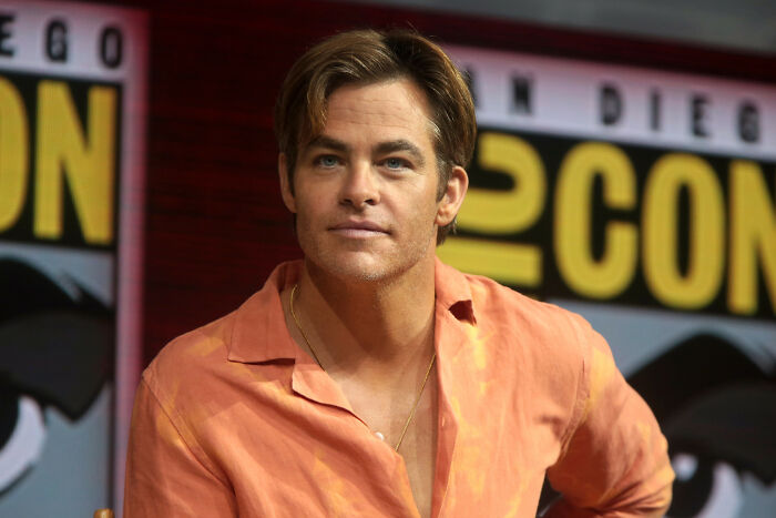 Actor at a panel event representing smartest celebrities known for being talented and intelligent in the entertainment industry.